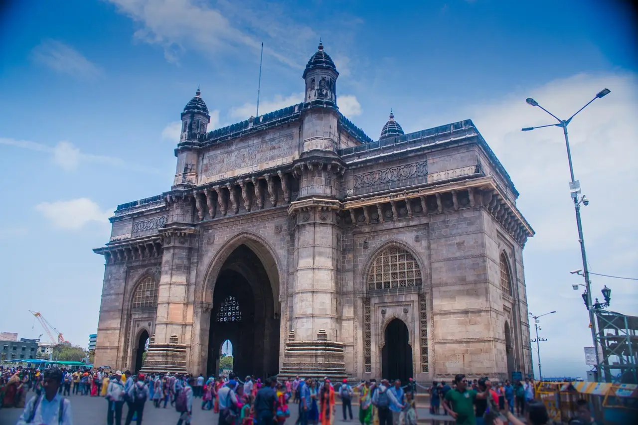 Gateway of India stone archway with boats on Arabian Sea backdrop