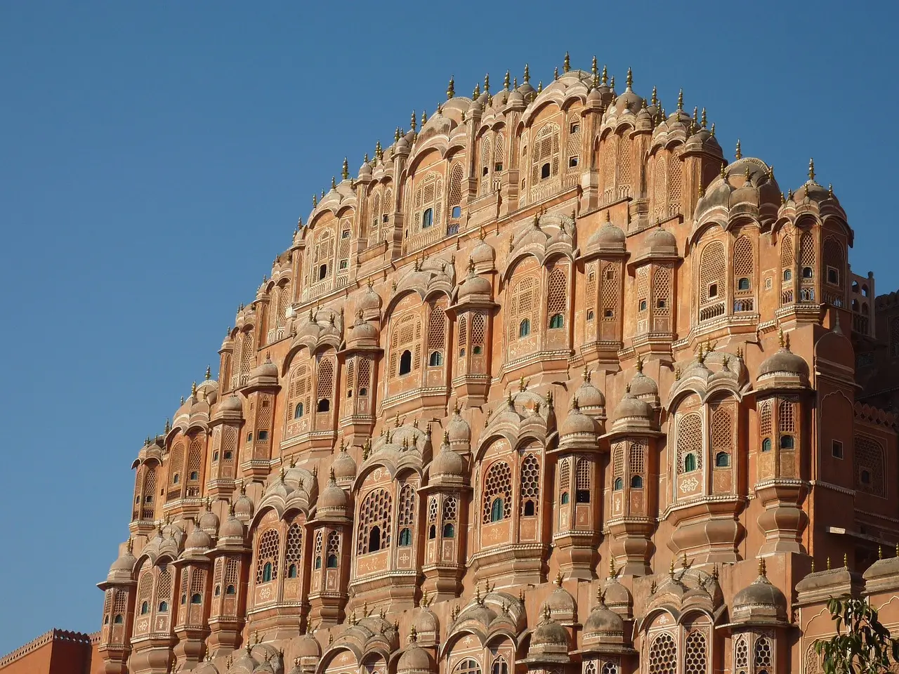 Ornate palace courtyard with pink sandstone architecture in Jaipur