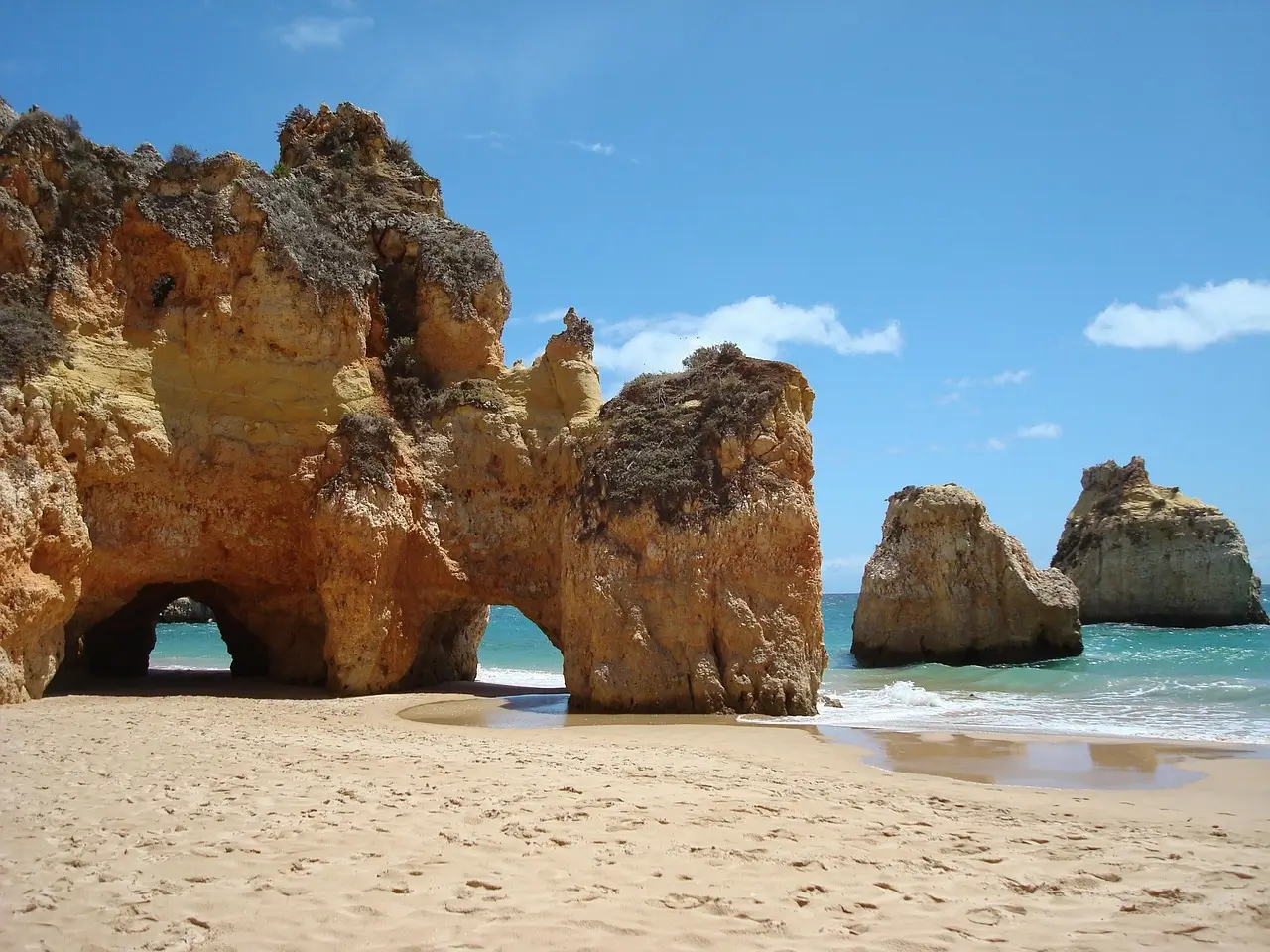 Golden cliffs and turquoise waters of Algarve coastline