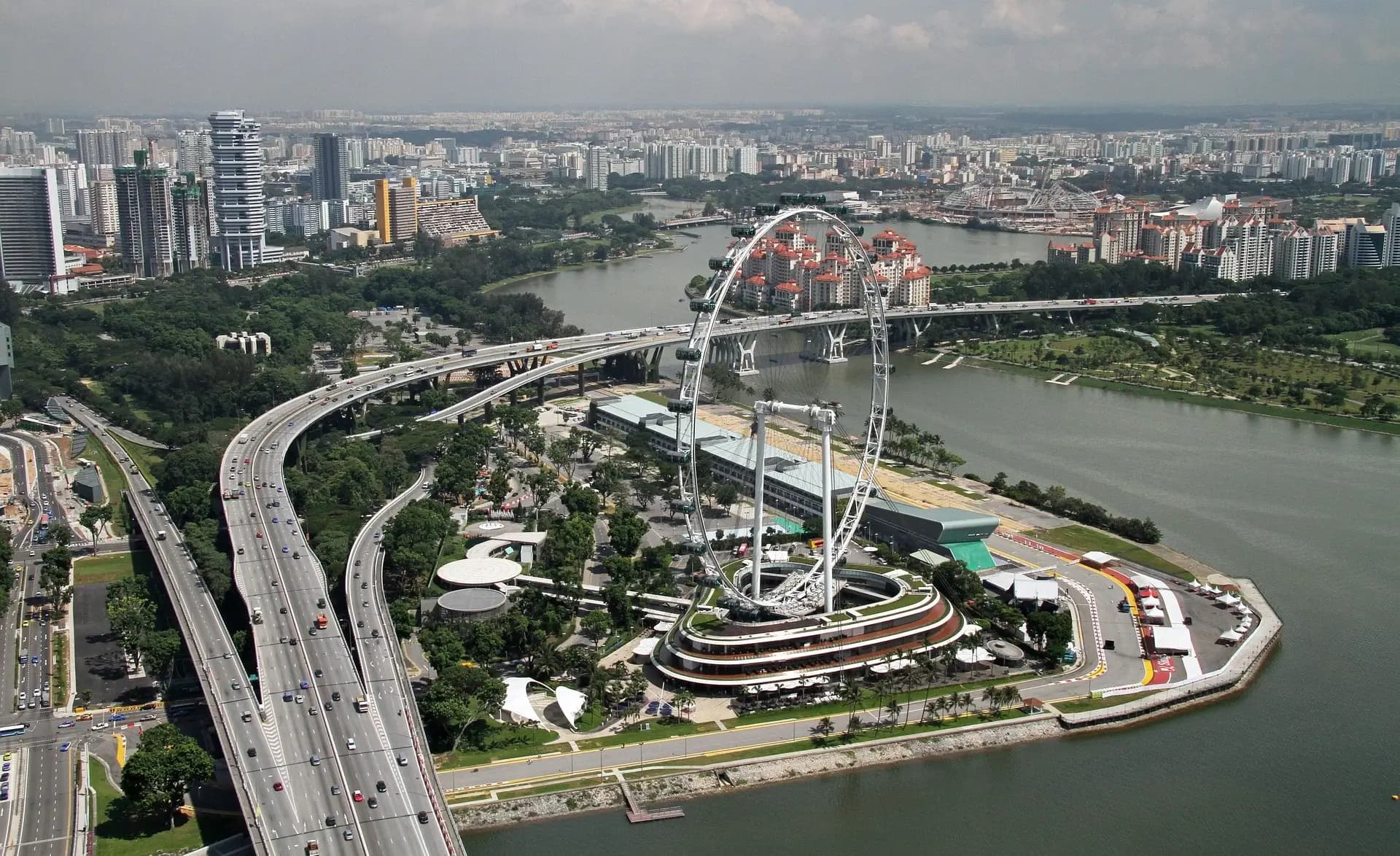 Singapore Flyer observation wheel against sunset sky
