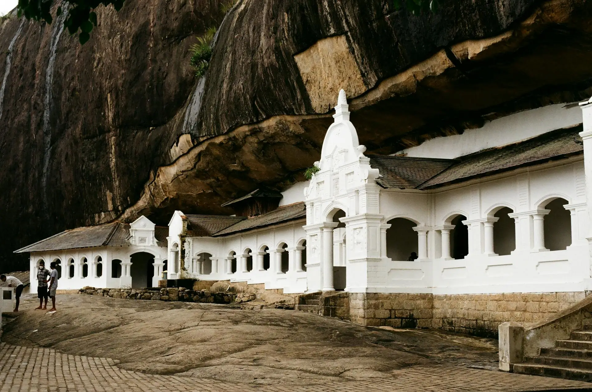Interior of Dambulla Cave Temple with Buddha statues and painted ceiling