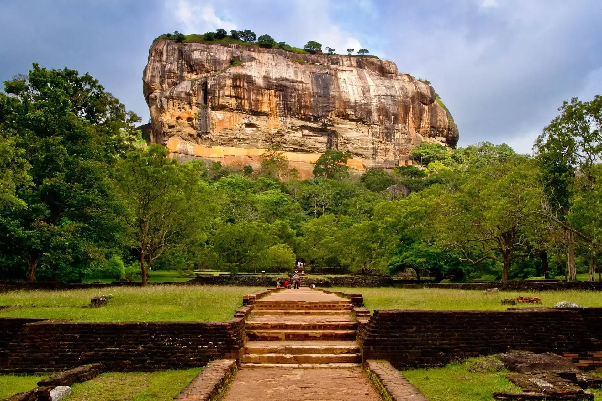 Sigiriya Rock Fortress at sunrise with misty jungle below