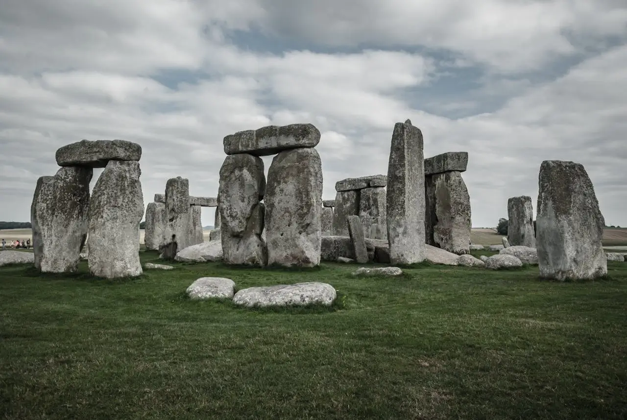 Stonehenge prehistoric stone circle under blue sky