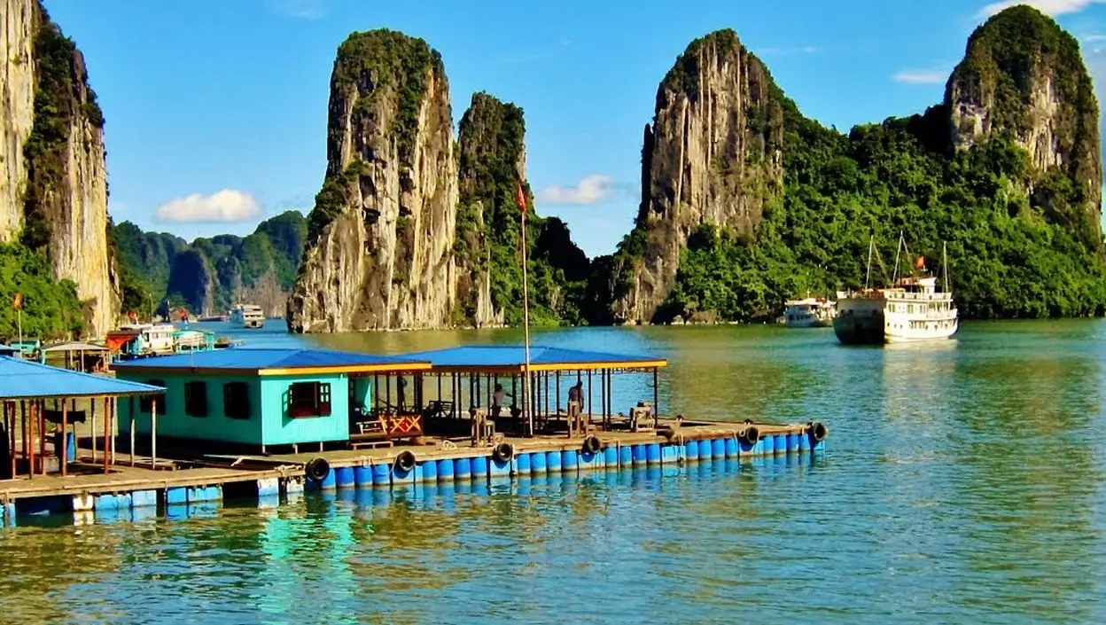 Towering limestone karsts in Halong Bay at sunset